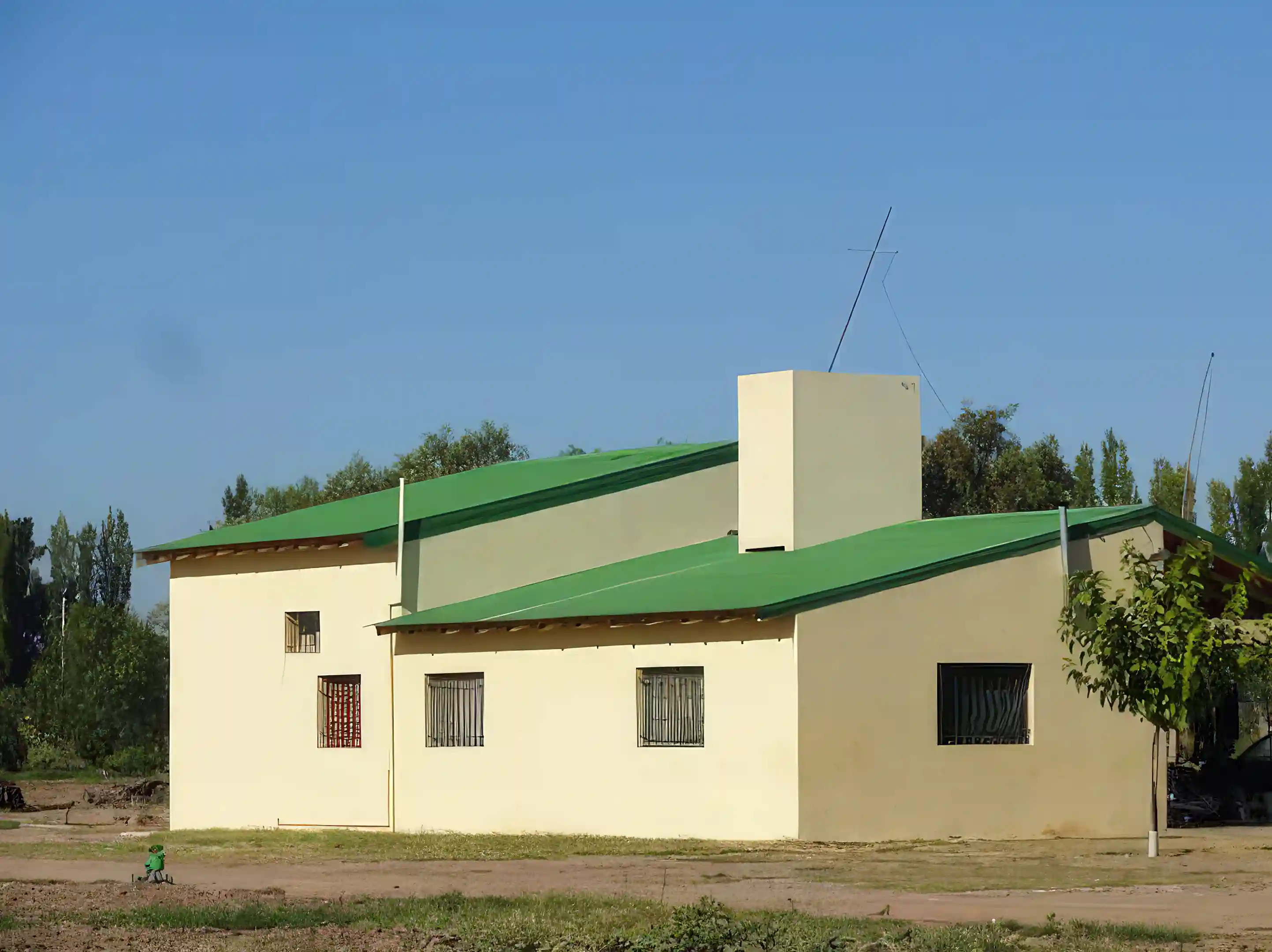 Exterior Worker's House. Construction is brick, concrete and stucco. There...