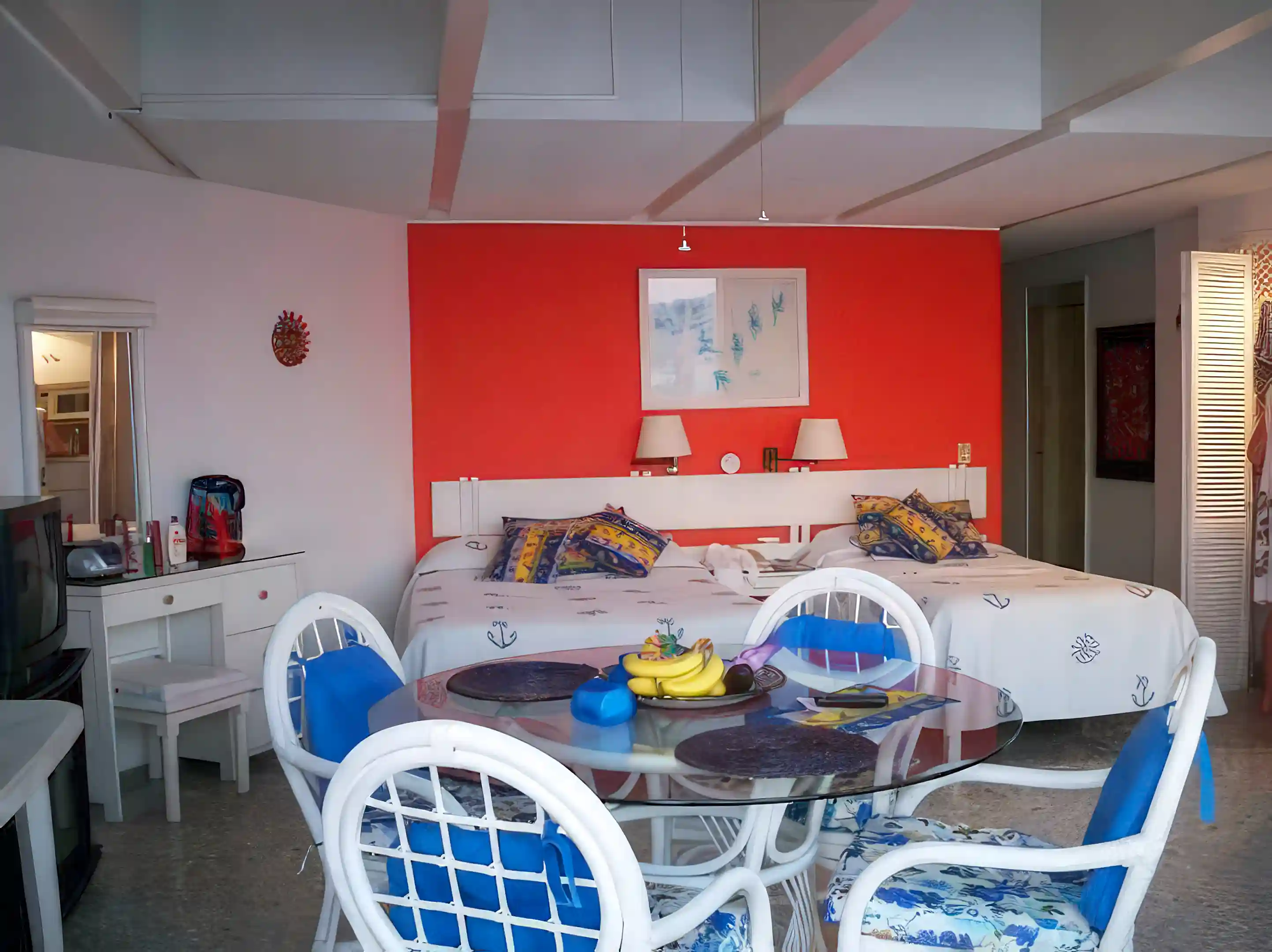 Inside dining area, bed area, make-up vanity and mirror