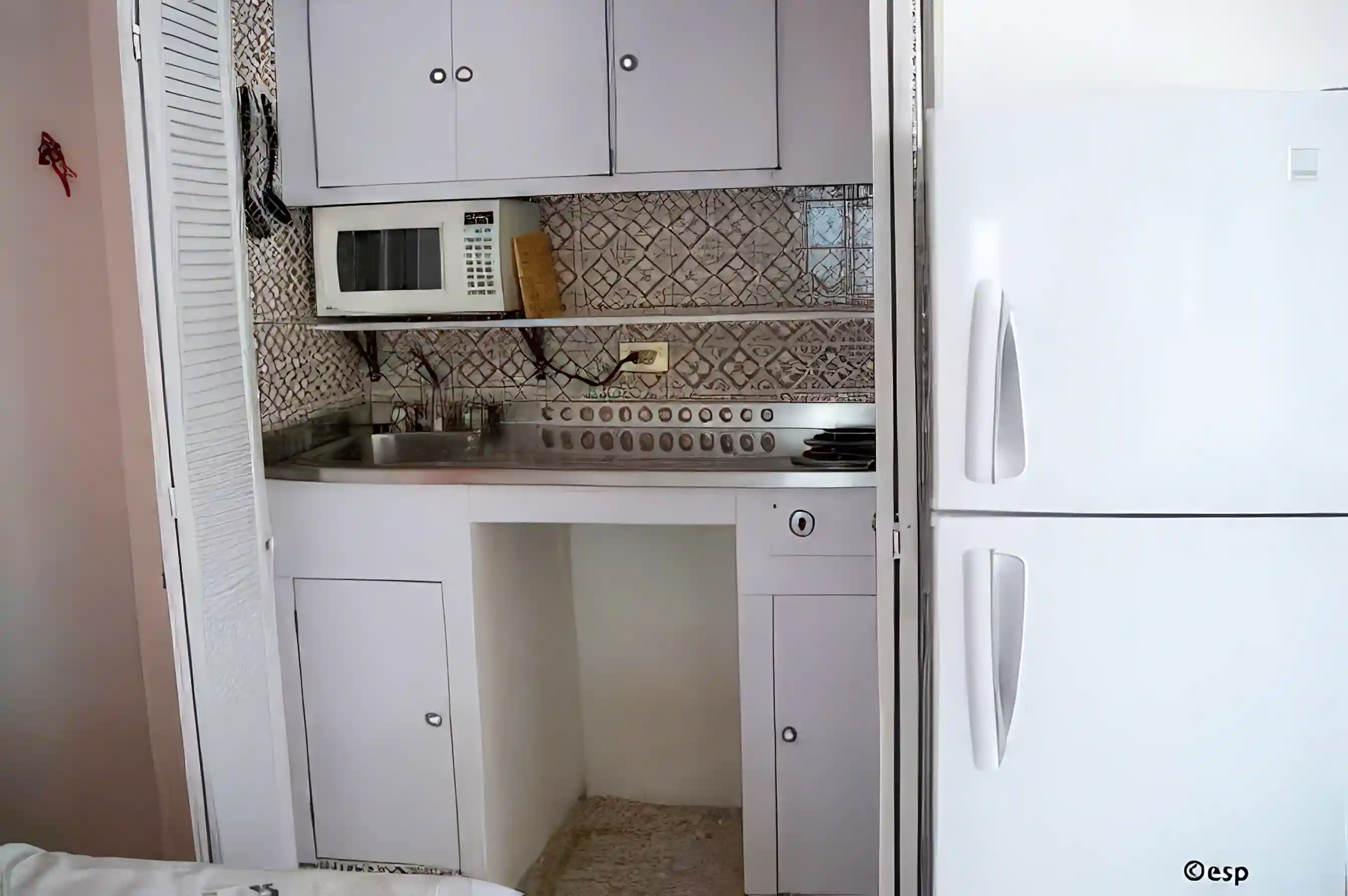 6. Kitchenette with microwave, 2-burner stove, fridge with separate freezer...