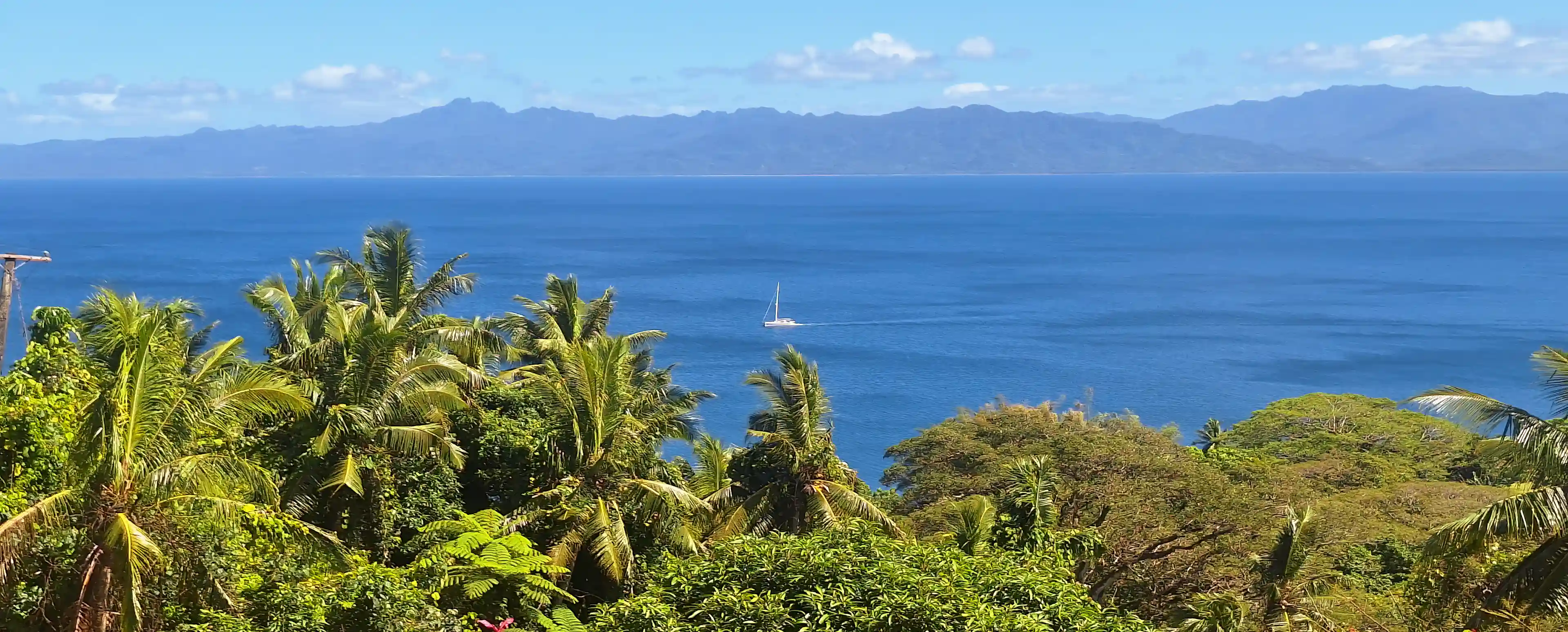 View on sea and incoming sailing boat