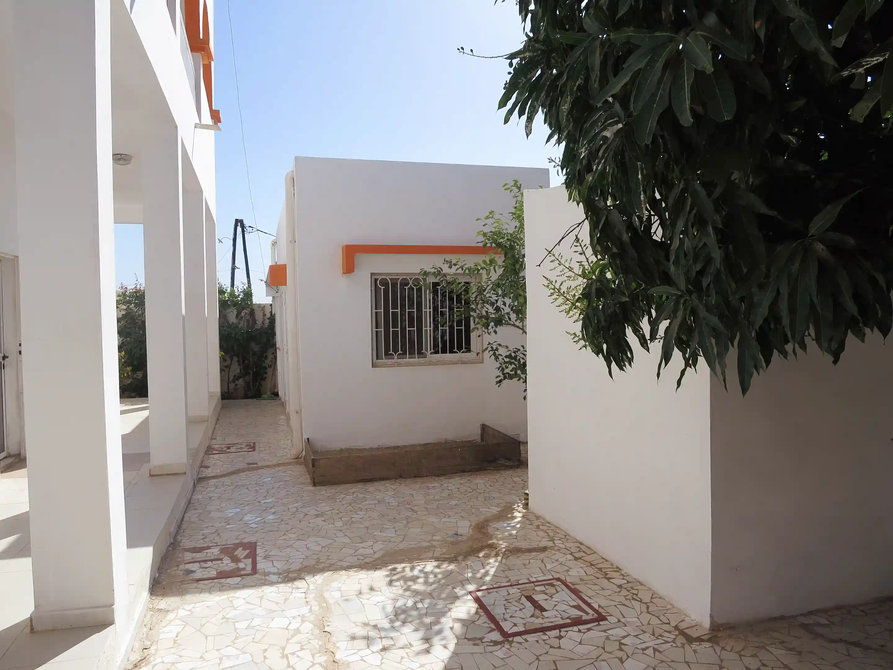 Yard at back of villa with servants quater.