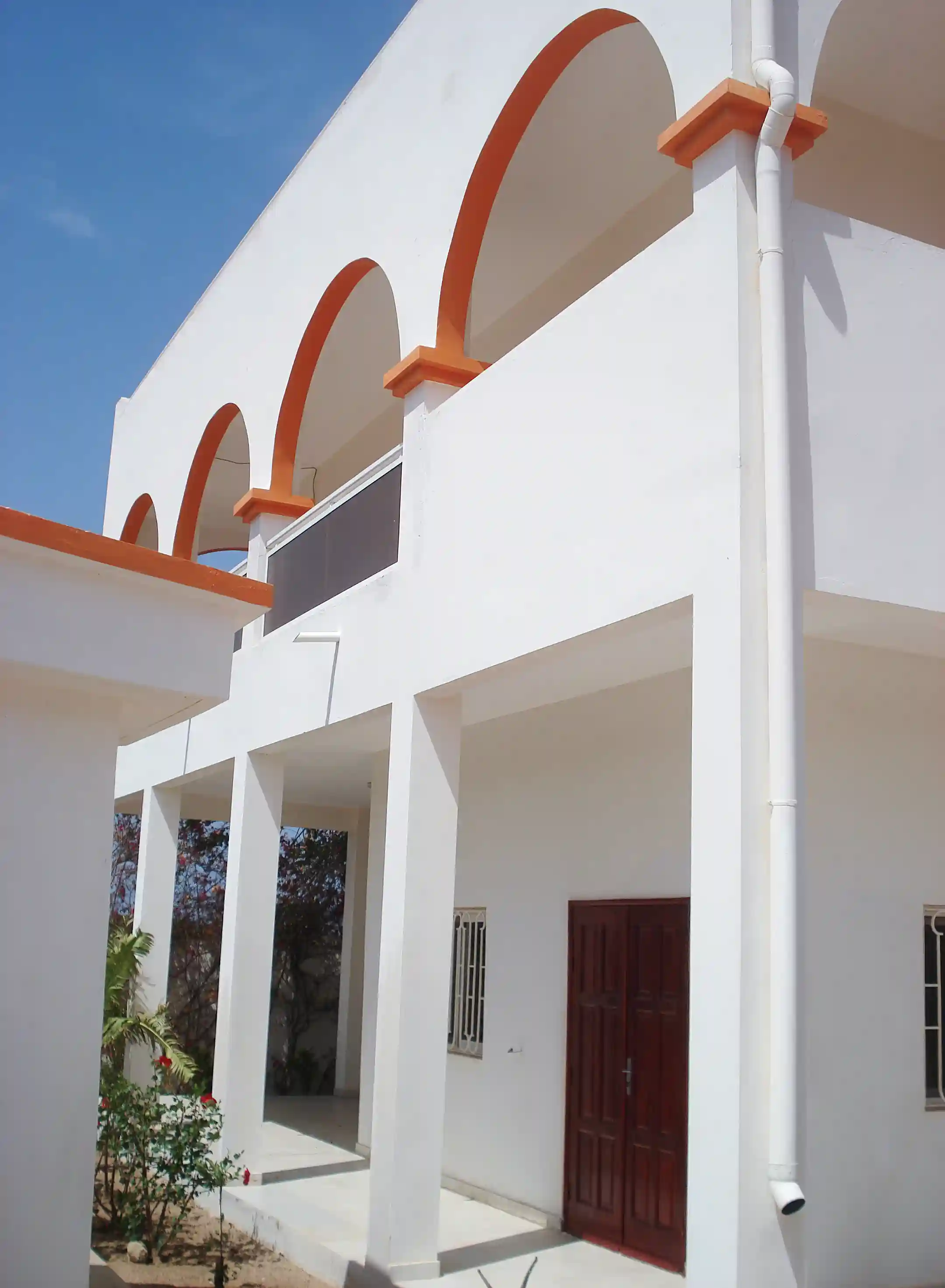 Front of villa with main entrance to the left of...