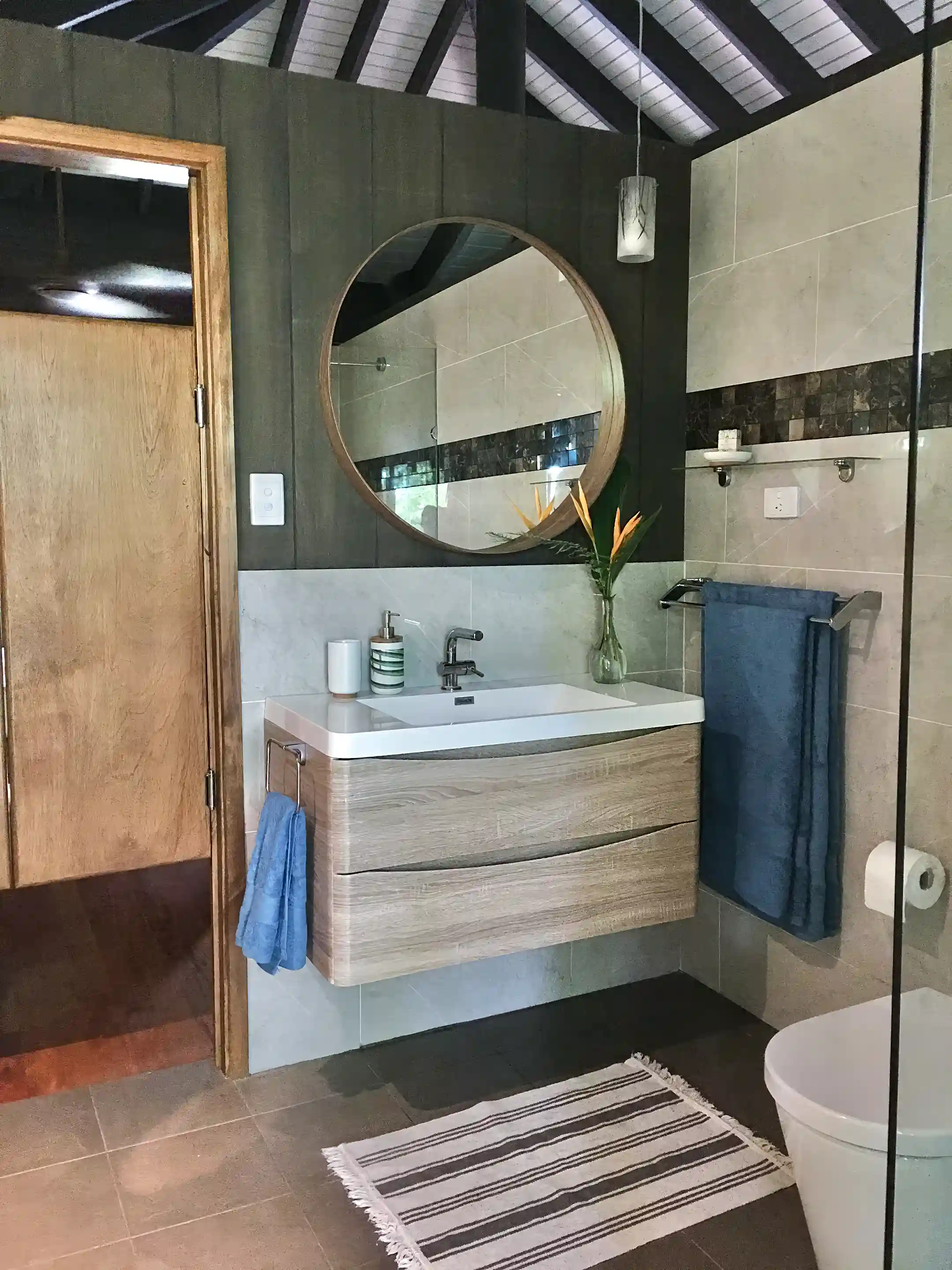 Modern vanity, toilet and 1200 x 1200mm rainfall showers in...