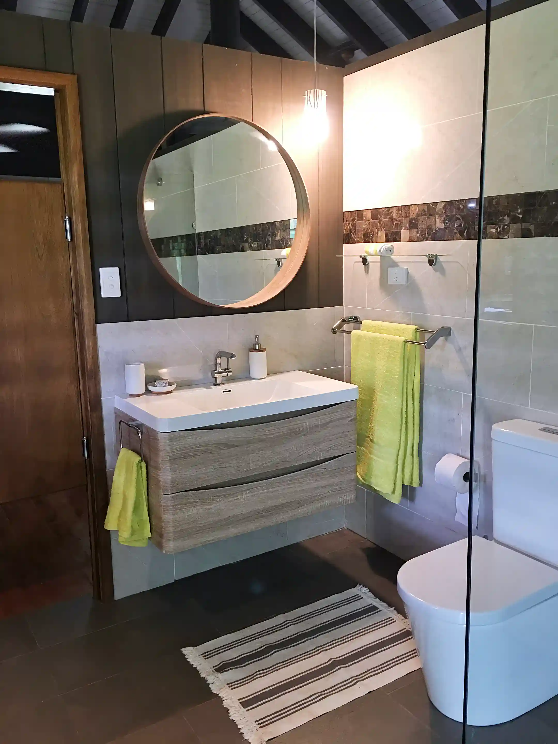 Modern vanities, toilet and walk in shower in both villas