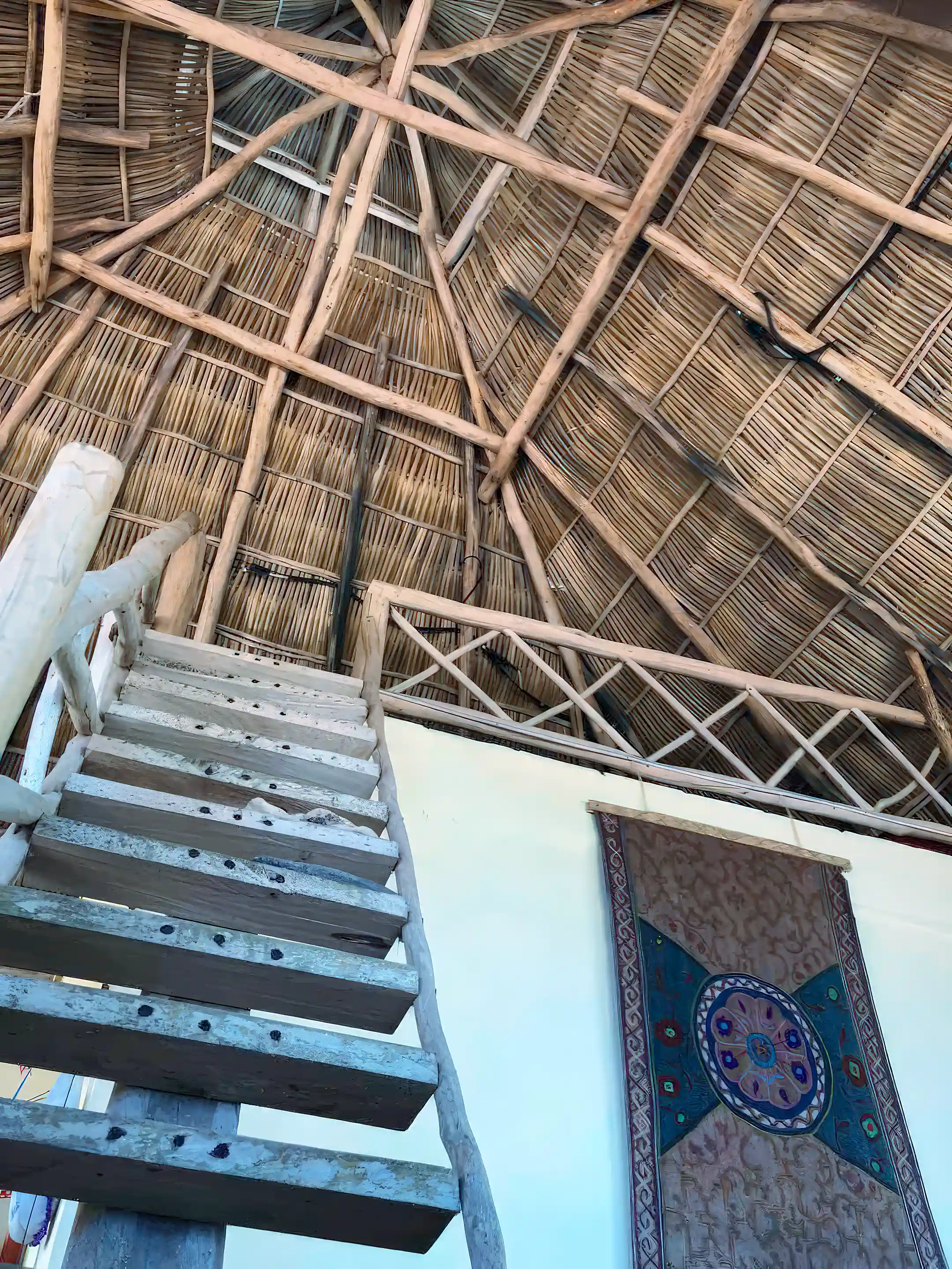 Steps up to the sleeping platform: above is the palapa...