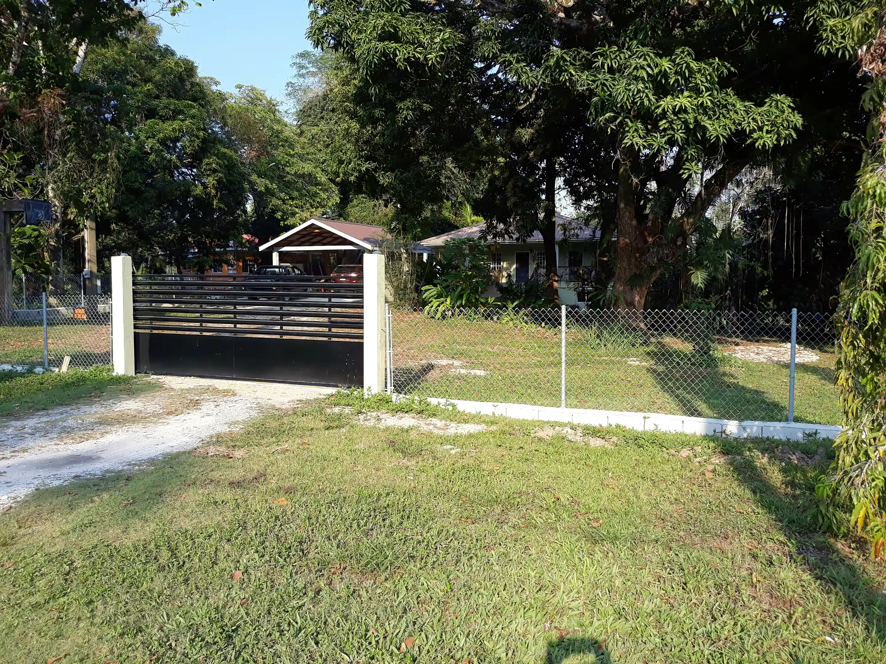 Entrance with electronic gate opener