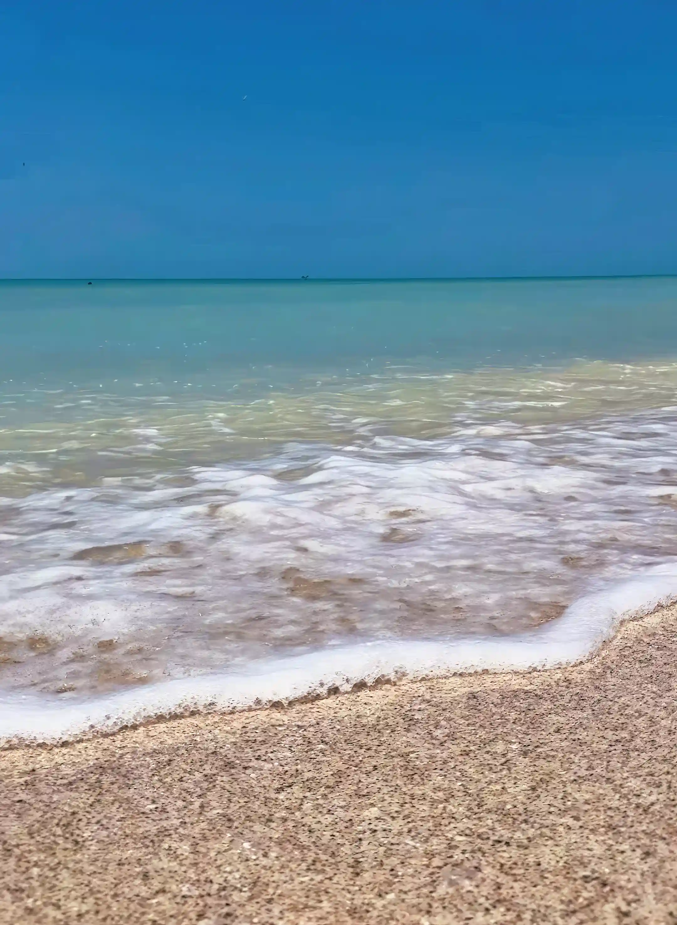Clear Turquoise soft white sandy beach