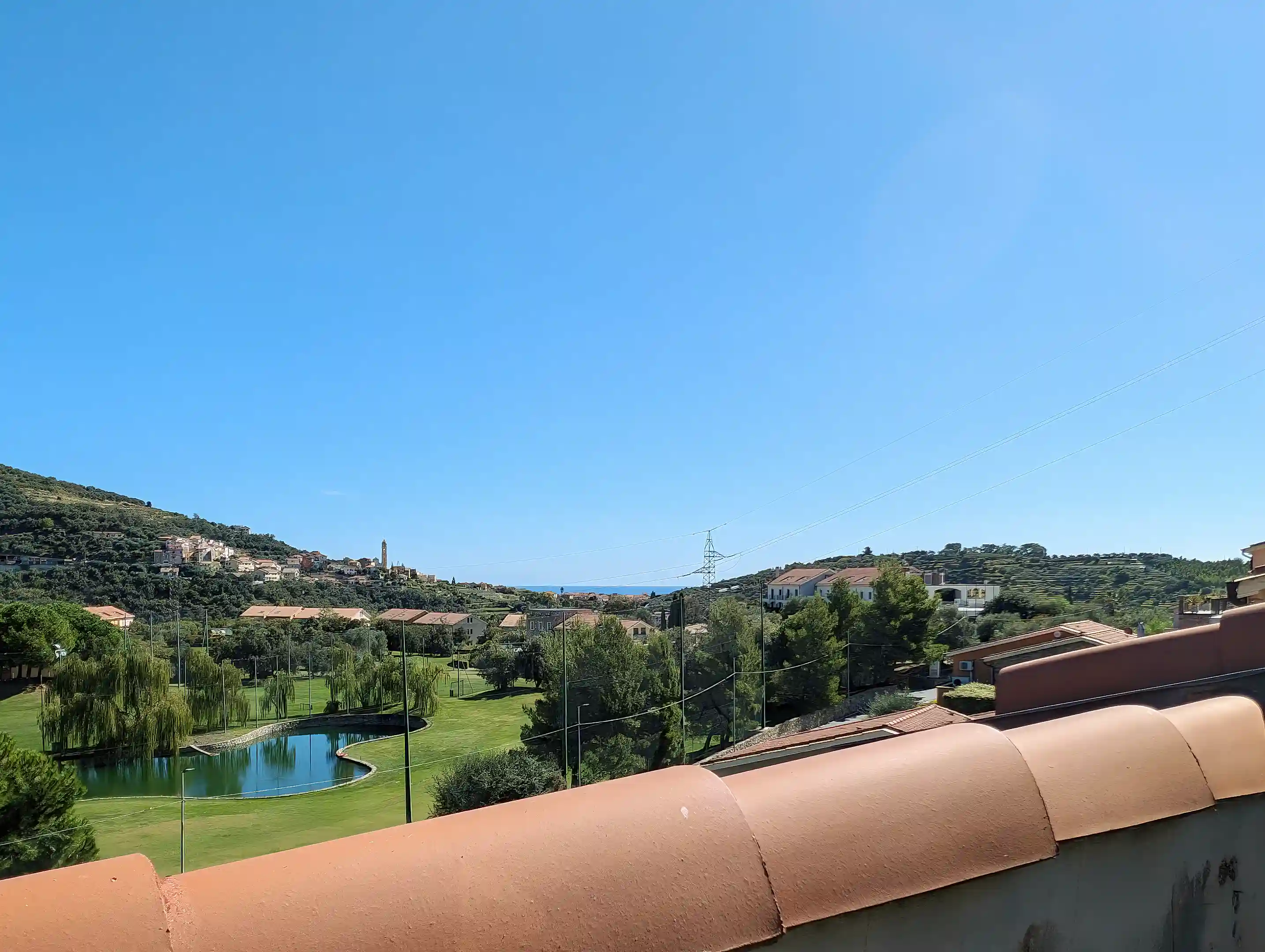 Golf court view with sea at horizon