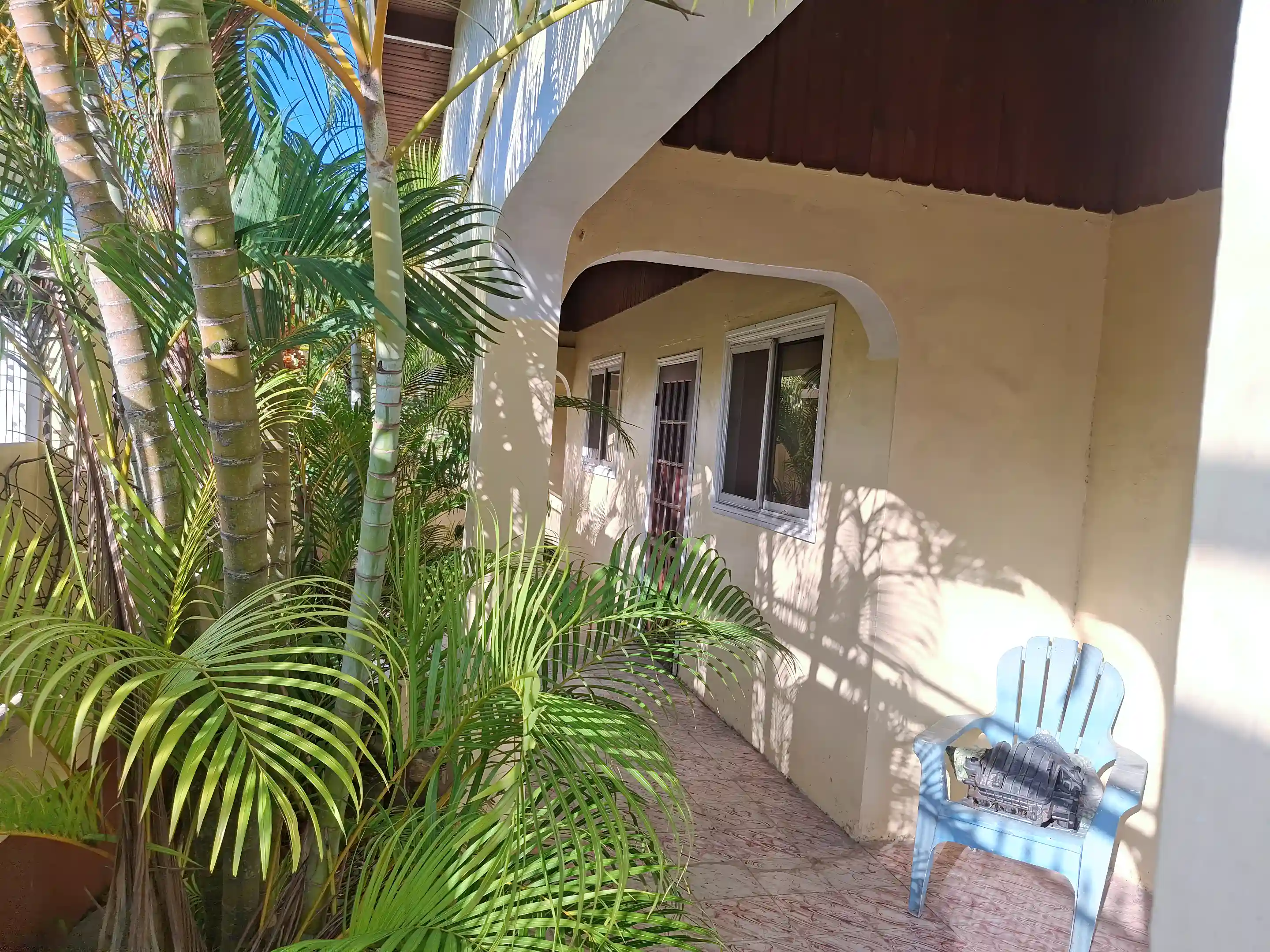 Frontal entryway with garage at the end.