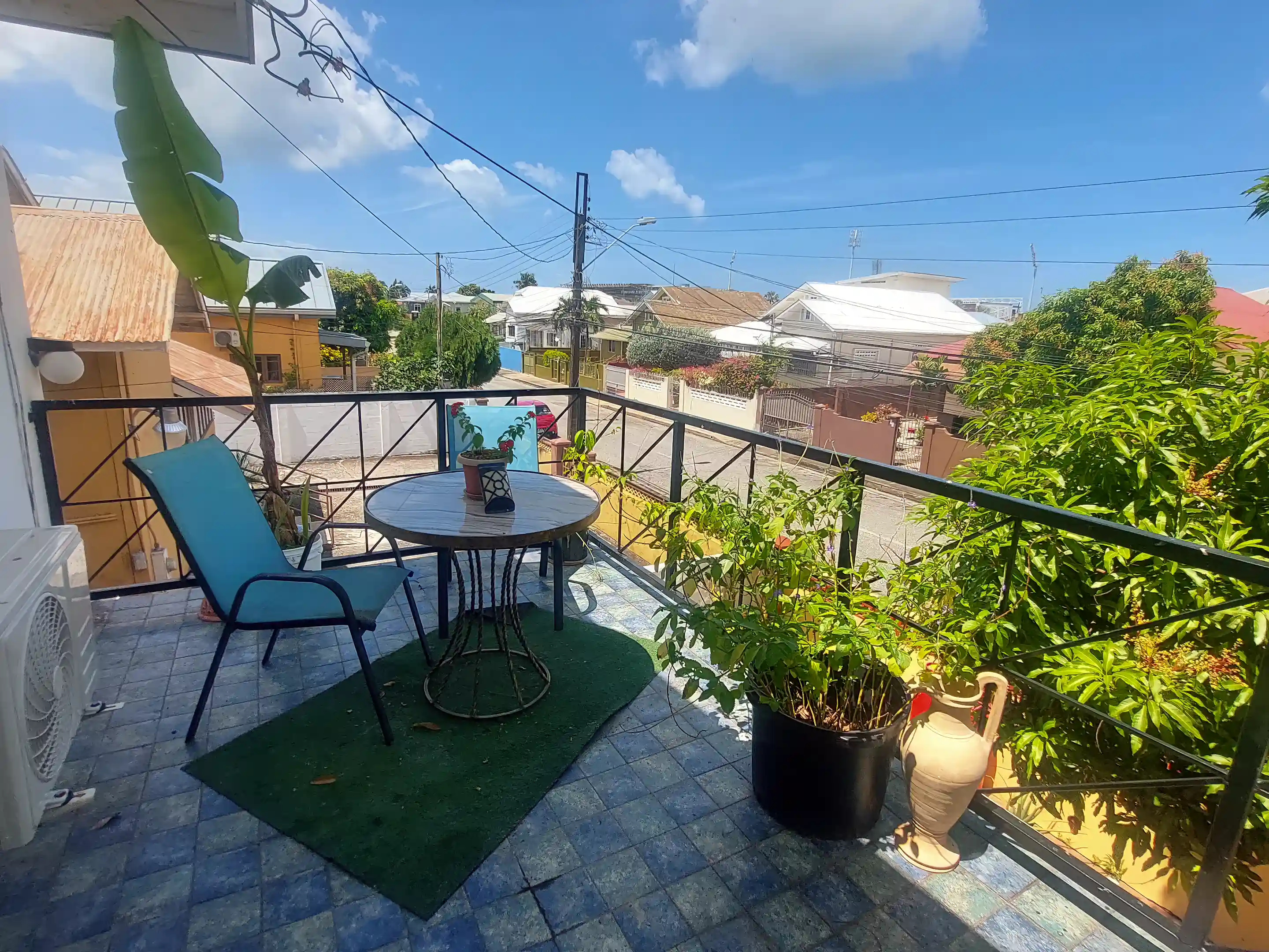 Balcony view from upper-level front bedroom with East Indian theme