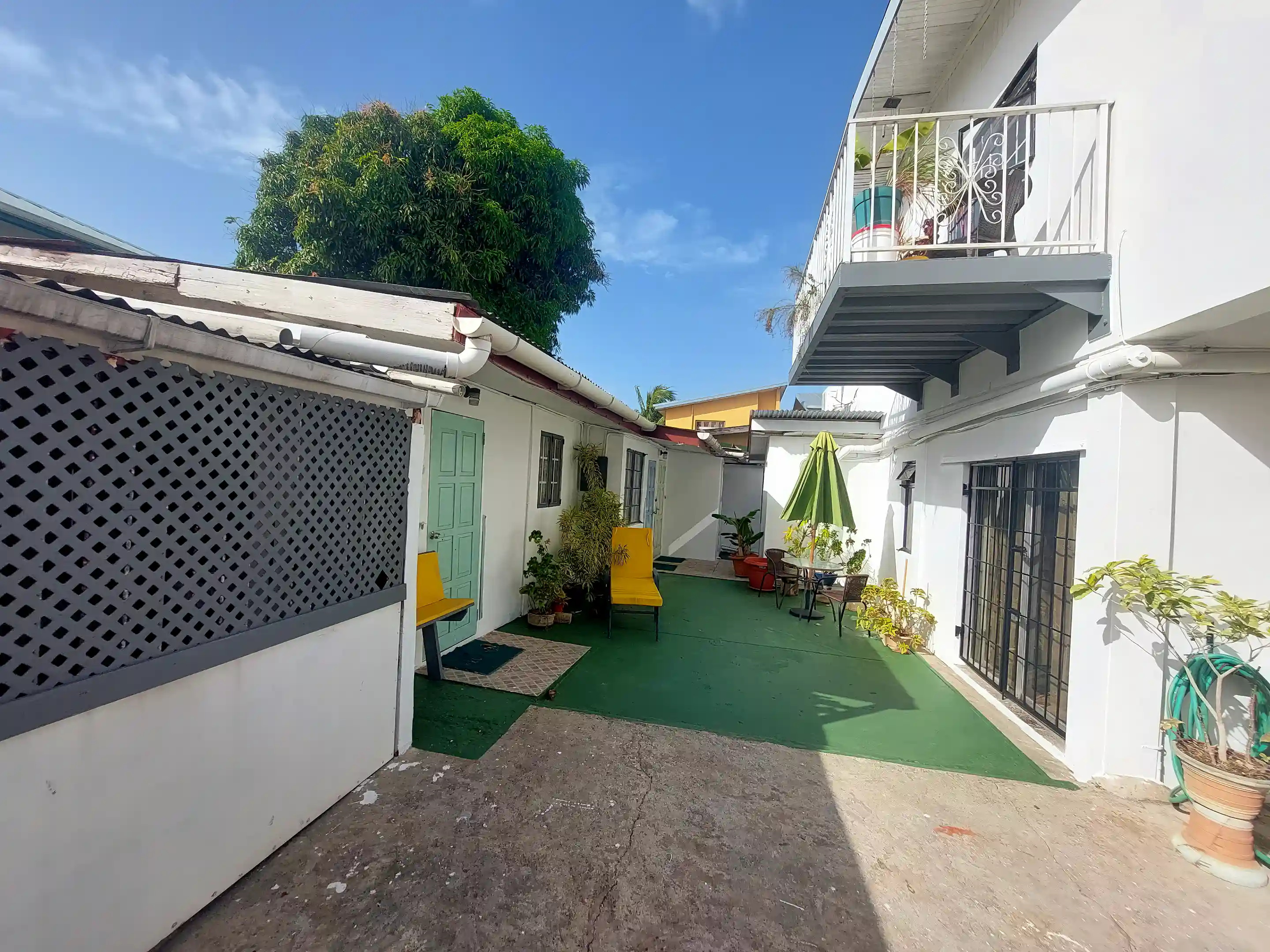 Rear courtyard with annex containing 3 en-suite studios and a...