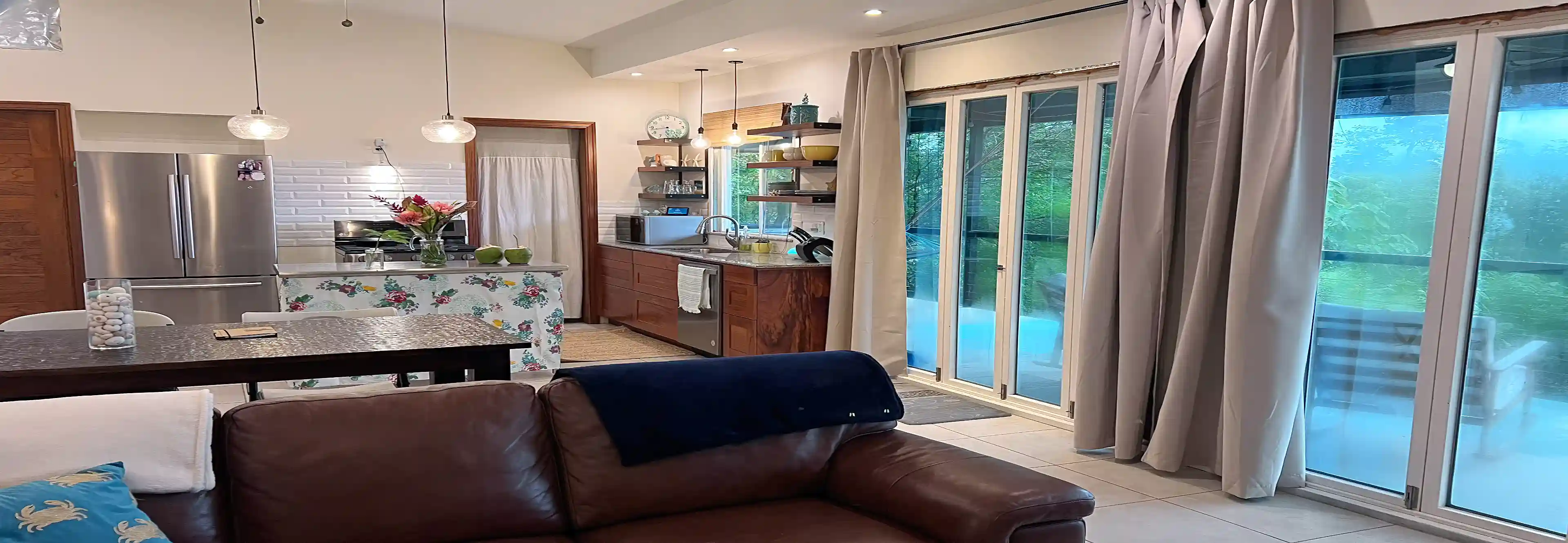 From the TV area, the open-plan layout comes into view,...