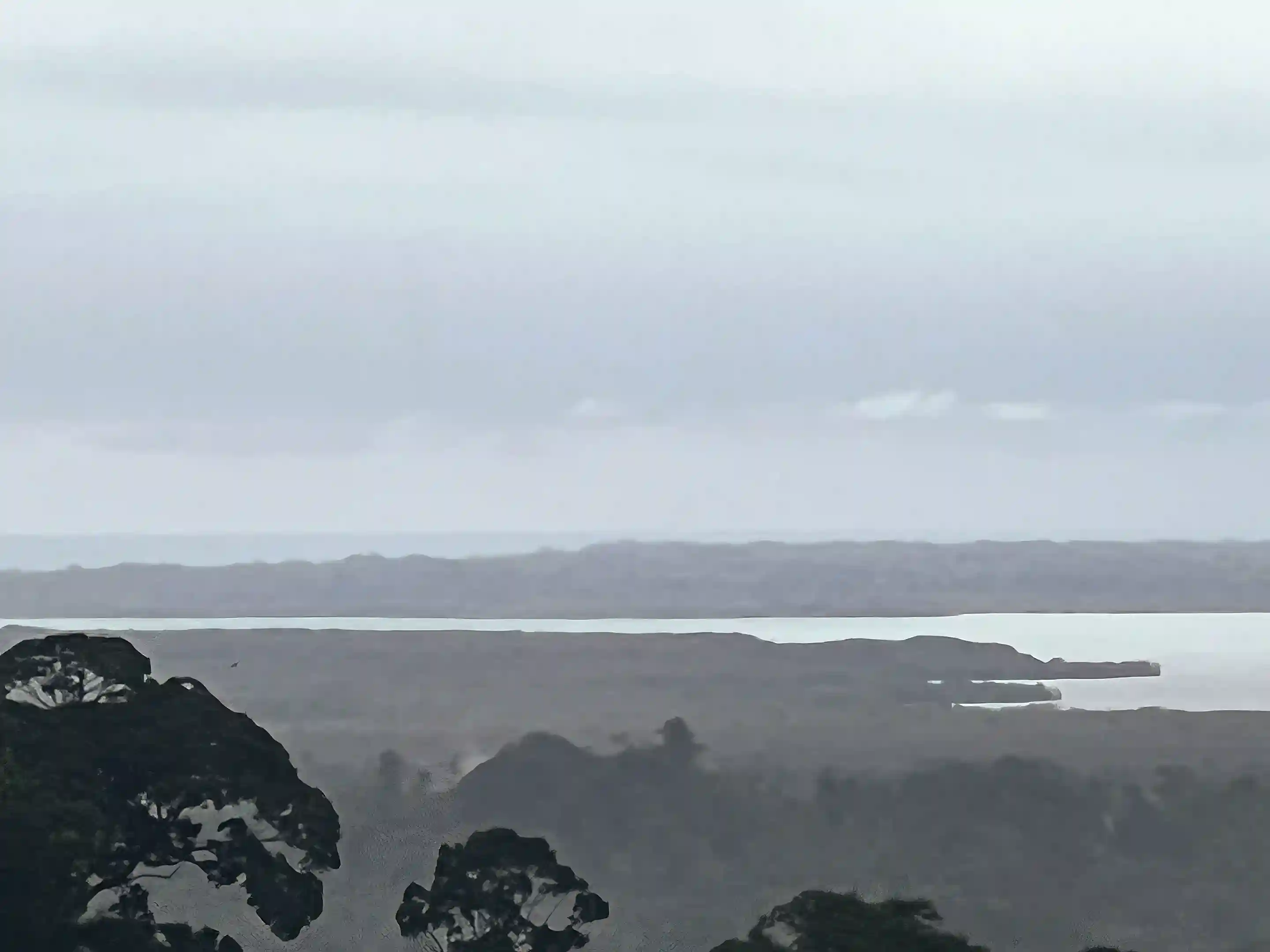 Zoomed view of the sea with Isla Colón in sight,...