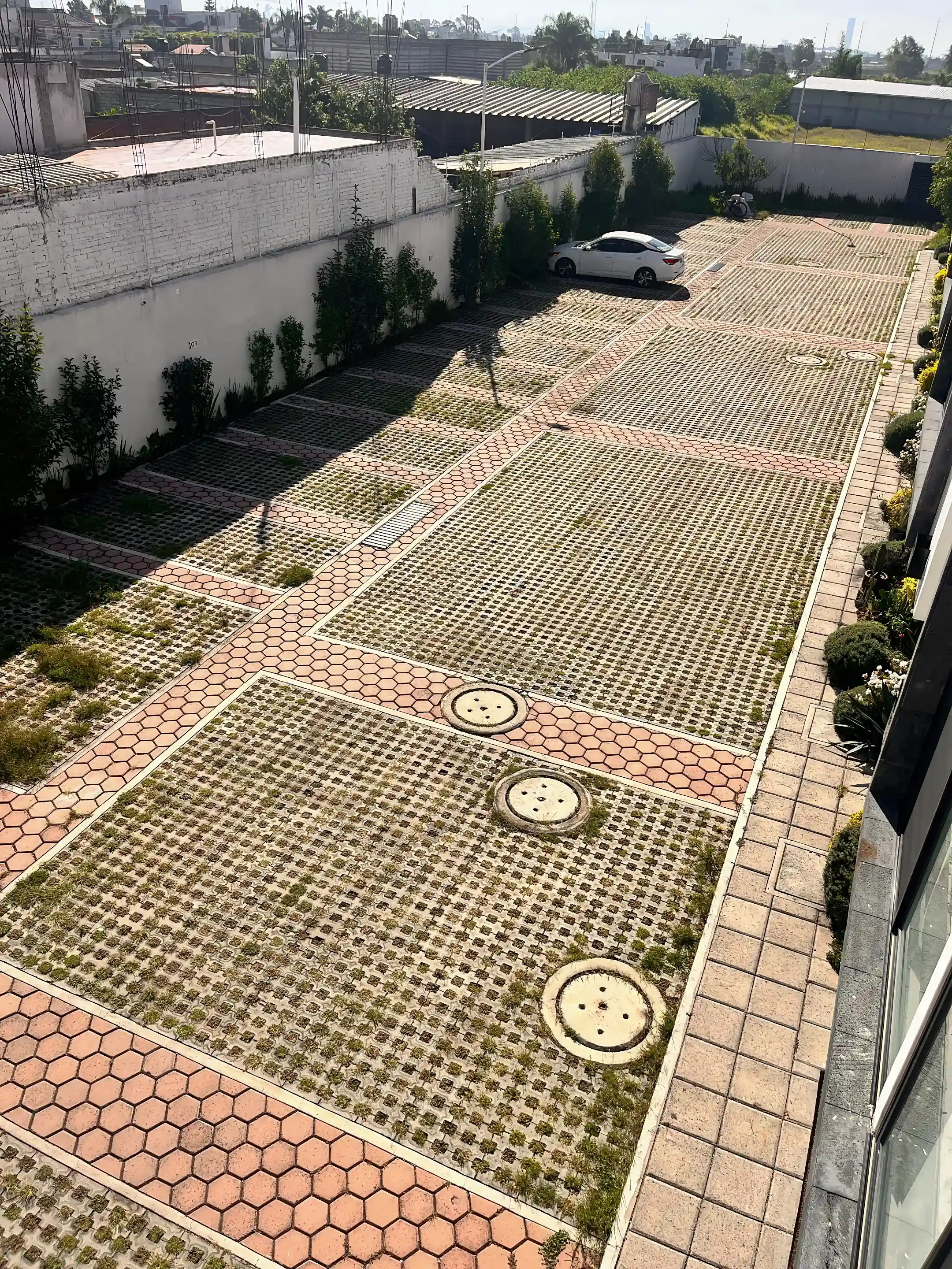 View of parking area from second rooftop