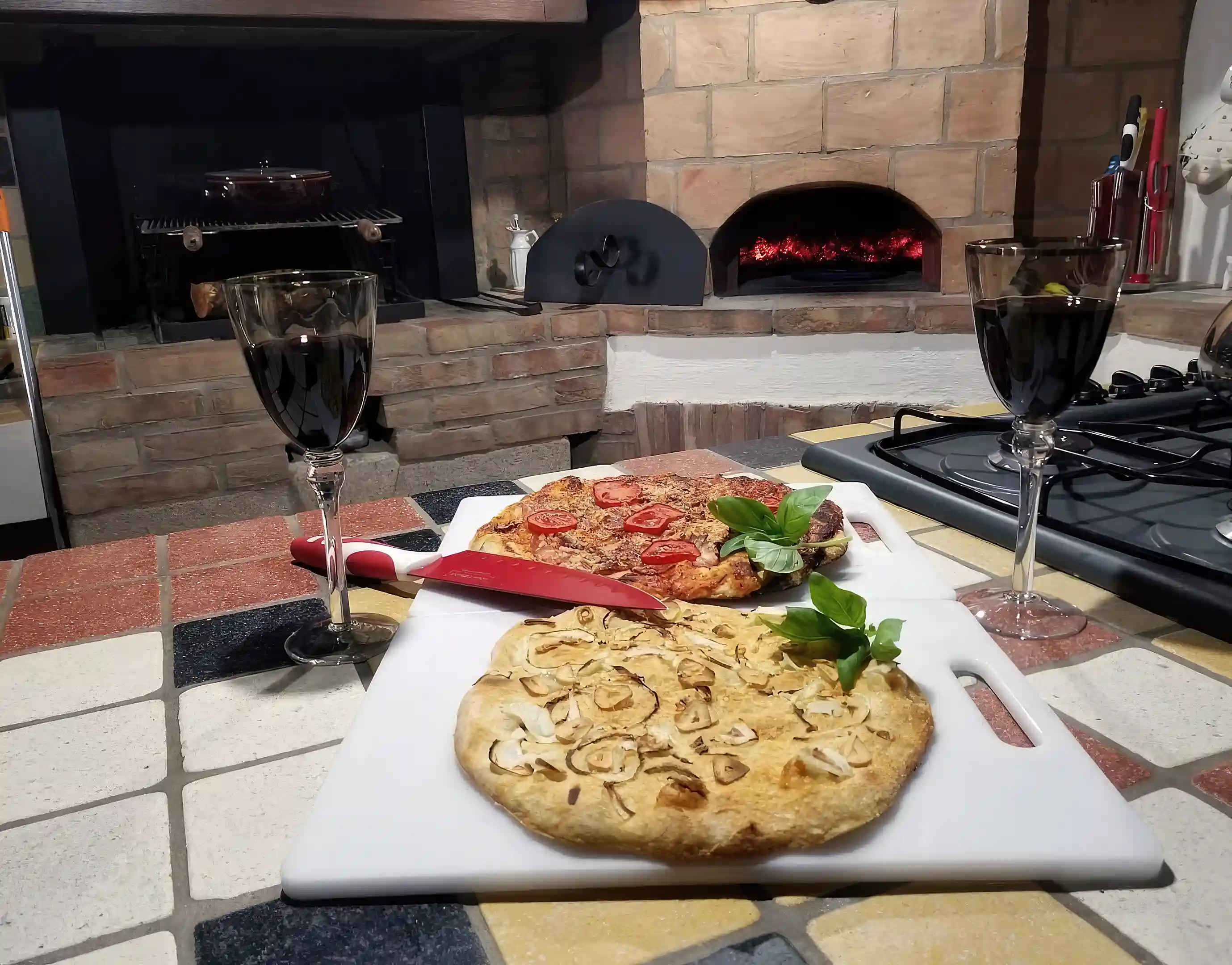 Kitchen with original open fire oven/grill and brick pizza oven