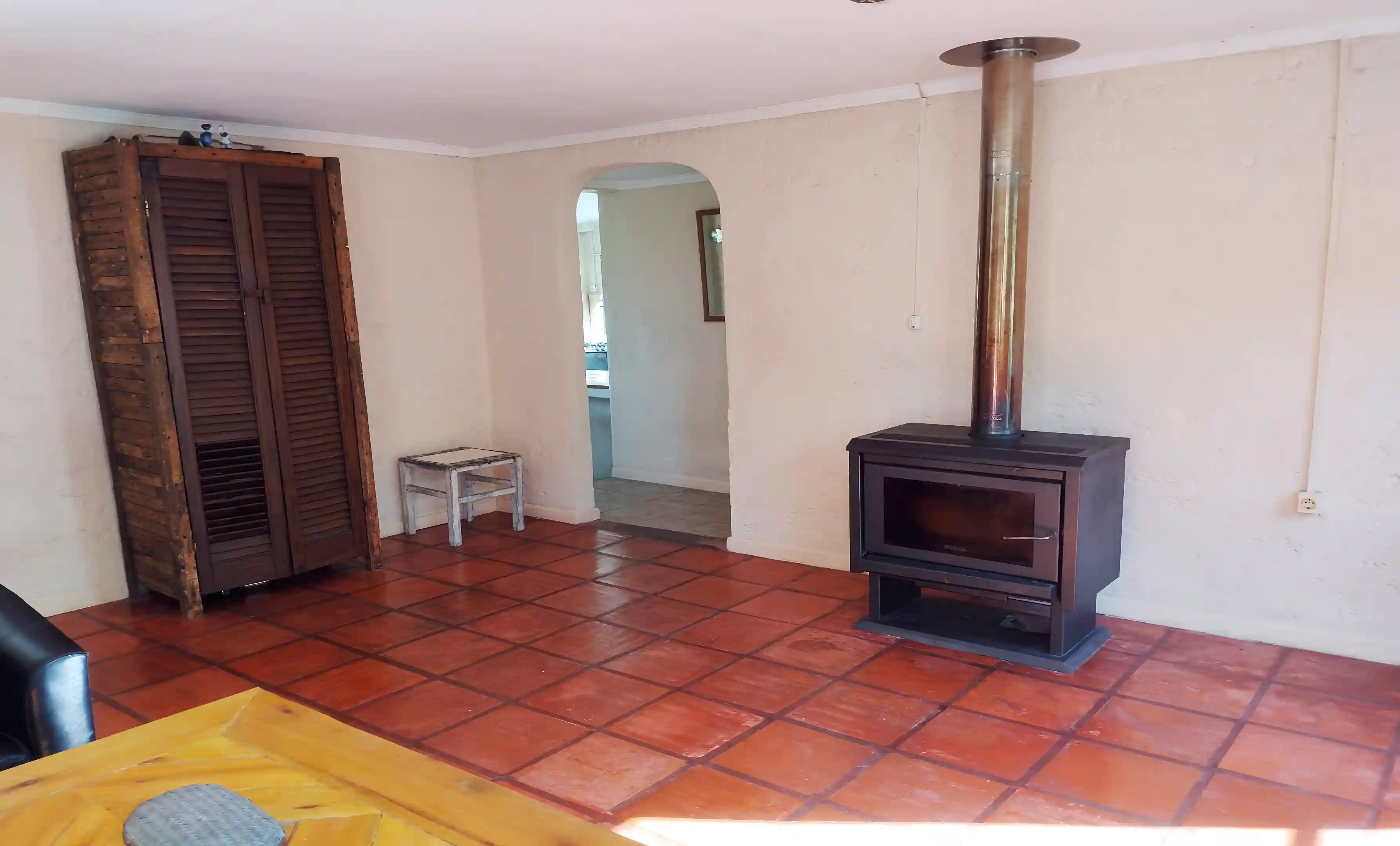 Living room with wood-burning stove and direct access to the...