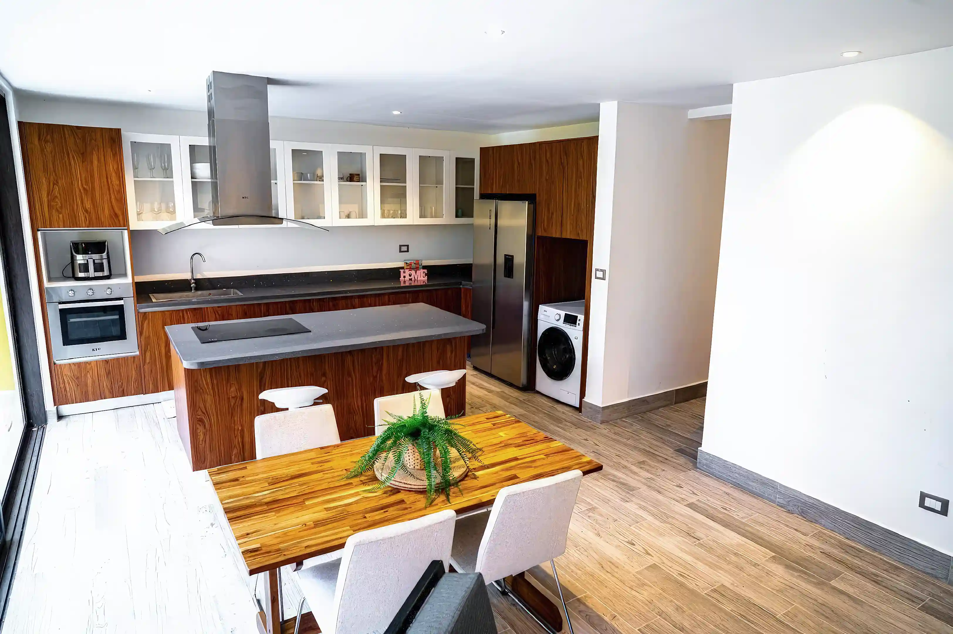 Spacious open-concept kitchen and dining area designed for both comfort...