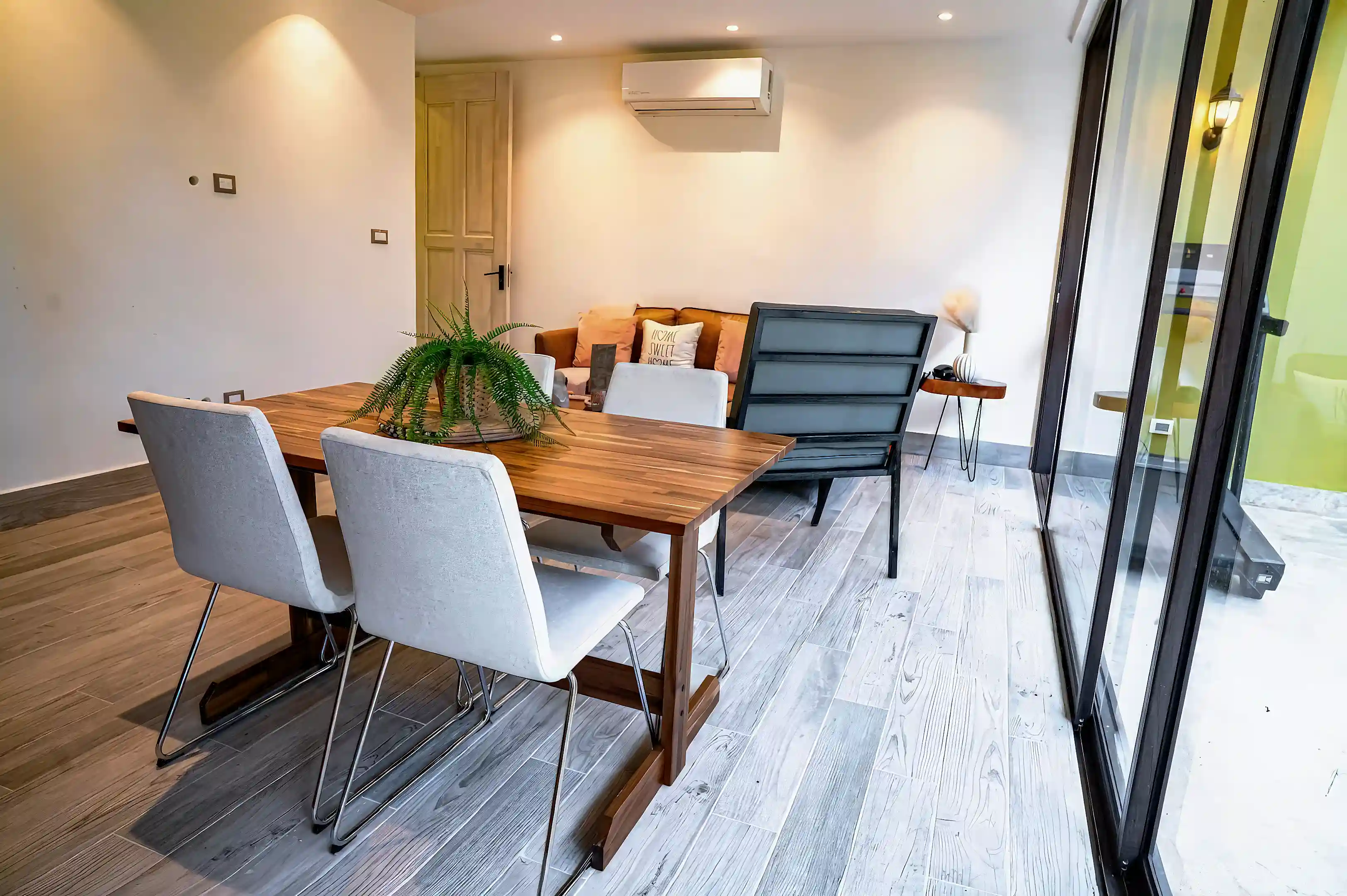 Bright and inviting open-concept dining and living area designed for...