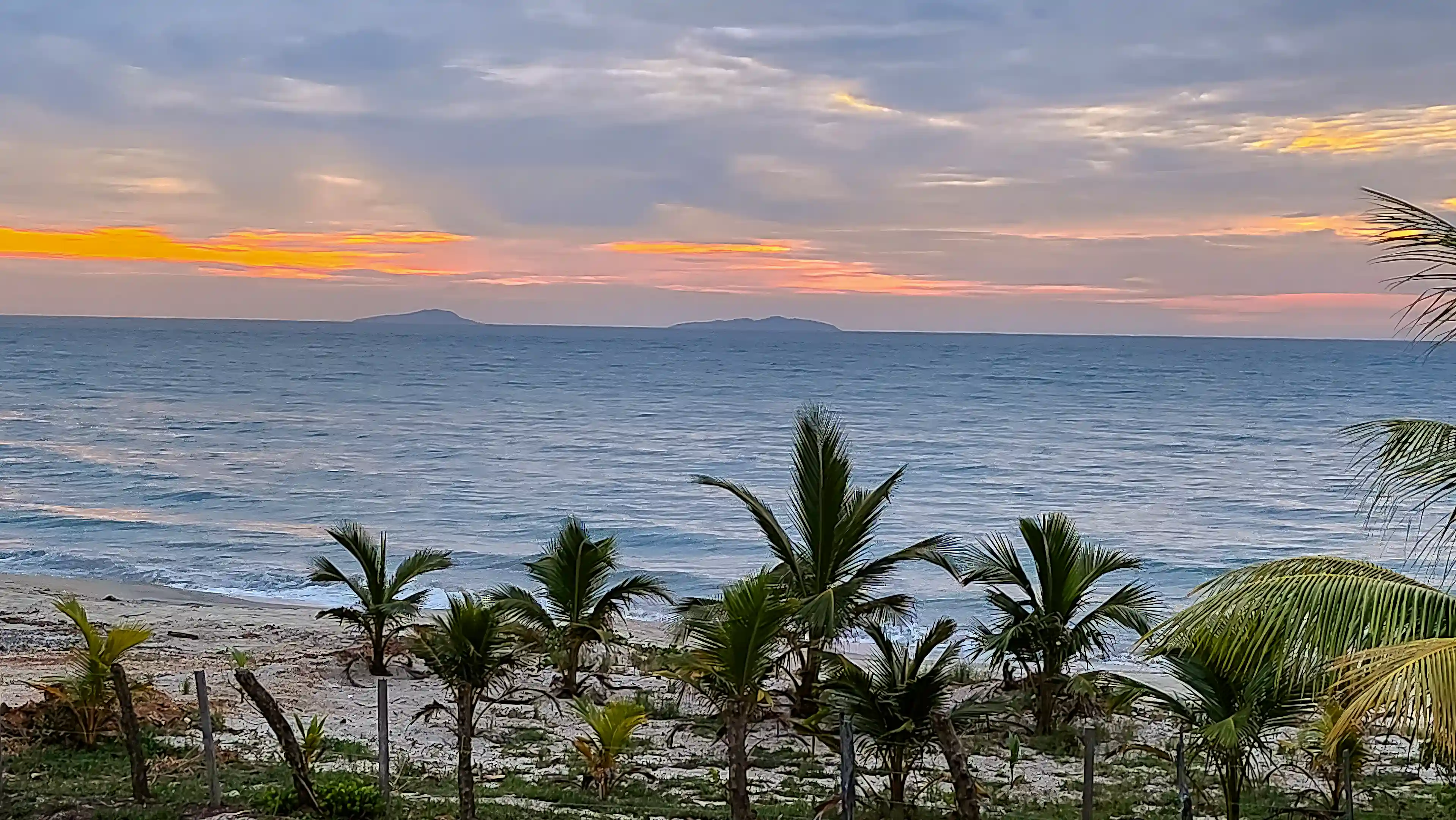 Two of the Cayos Cochinos Islands in the distance, looking...