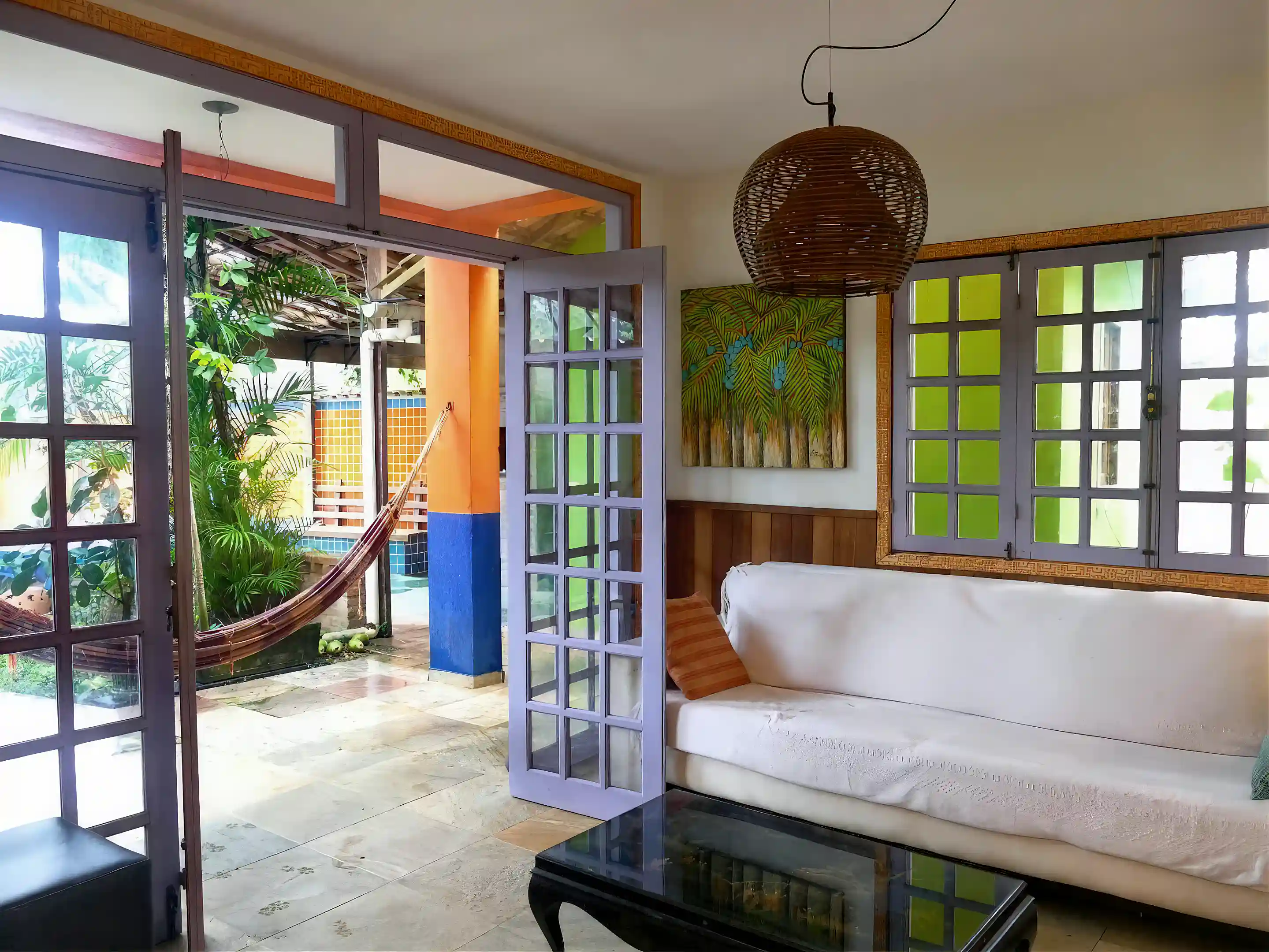 view from living room towards barbeque area and pool