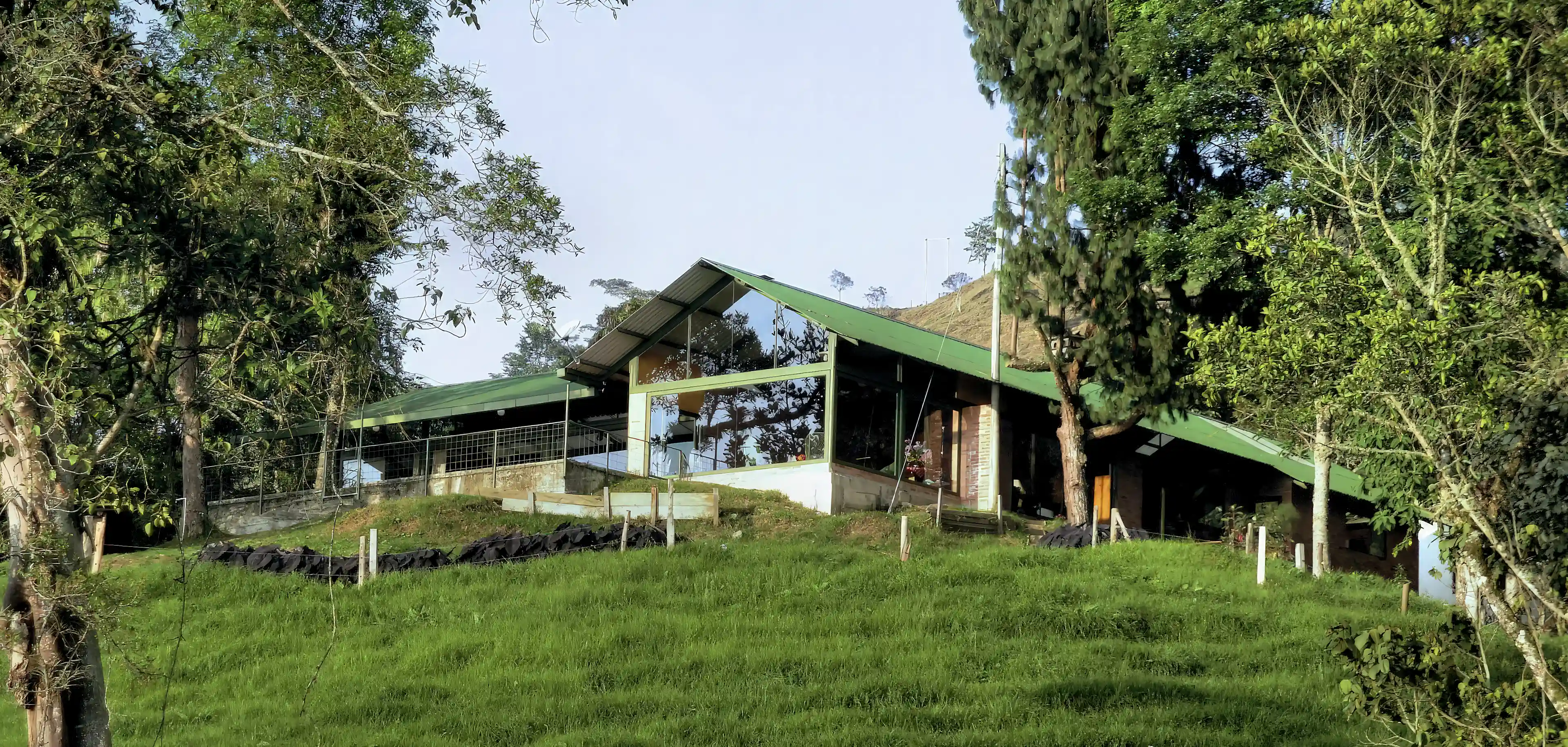 The main house, with floor-to-ceiling windows facing the view