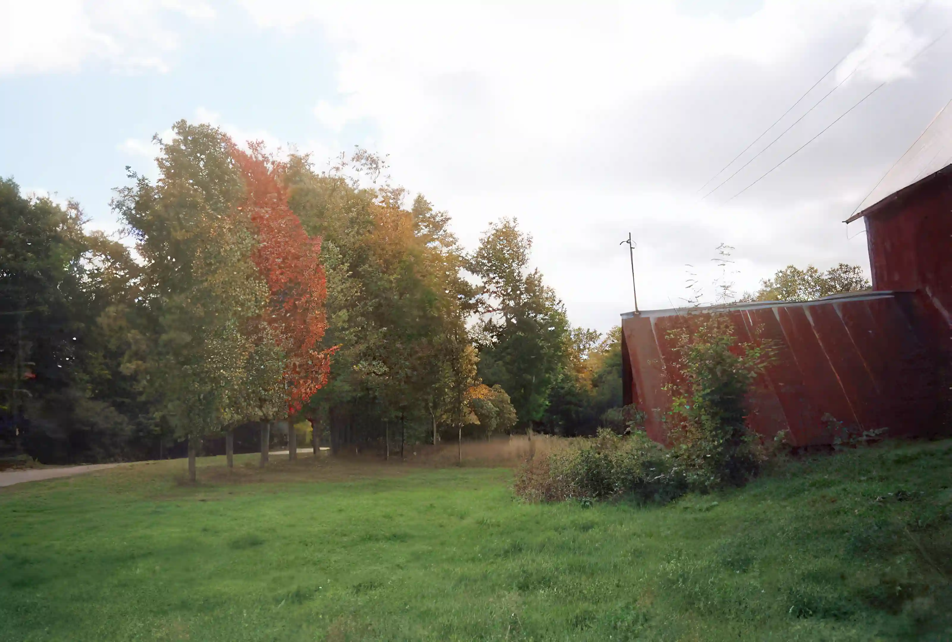 Looking south, barn to the right, road to the left.